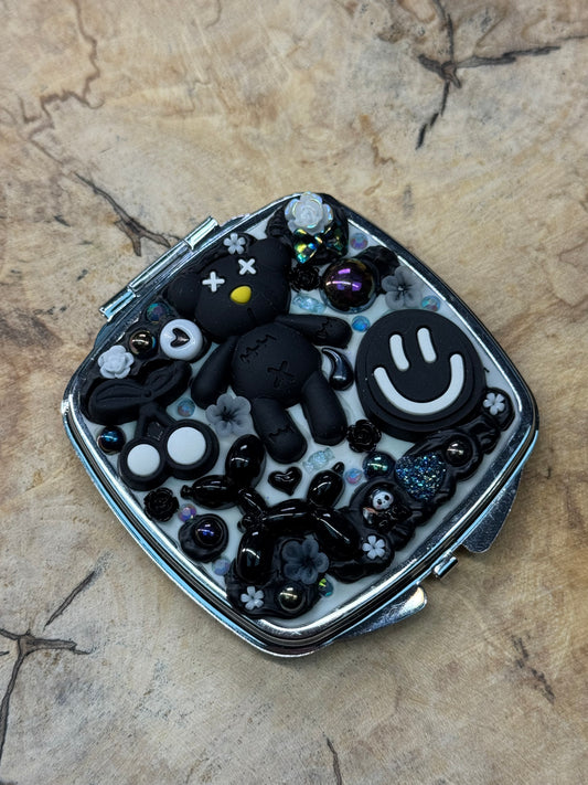 Black and white pre-made metal compact